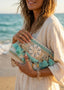 Pochette mare in juta con conchiglie e pouf turchesi - Follie by Alice