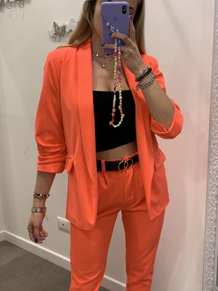 Giacca fluo con manica drappeggiata