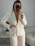 Pantaloni a palazzo con ricami floreali e paillettes