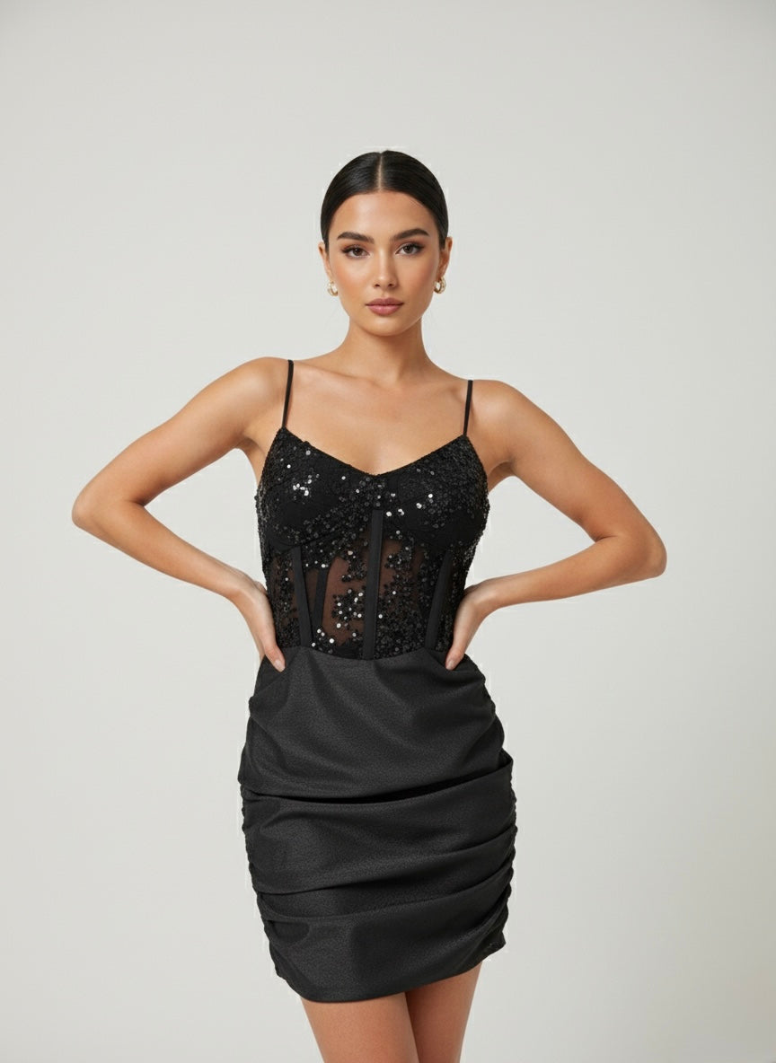 Vestitino drappeggiato in raso con top a bustier semitrasparente con paillettes