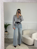 Jeans a palazzo con strass gioiello e fondo sfrangiato