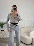 Jeans a palazzo con strass gioiello e fondo sfrangiato
