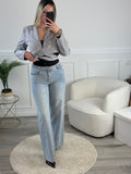Jeans a palazzo con strass gioiello e fondo sfrangiato