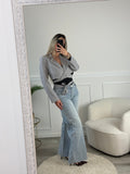 Jeans a palazzo con strass gioiello e fondo sfrangiato