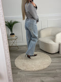Jeans a palazzo con strass gioiello e fondo sfrangiato