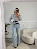 Jeans a palazzo con strass gioiello e fondo sfrangiato