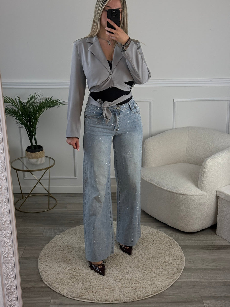 Jeans a palazzo con strass gioiello e fondo sfrangiato