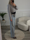 Jeans a palazzo con strass gioiello e fondo sfrangiato