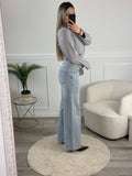 Jeans a palazzo con strass gioiello e fondo sfrangiato