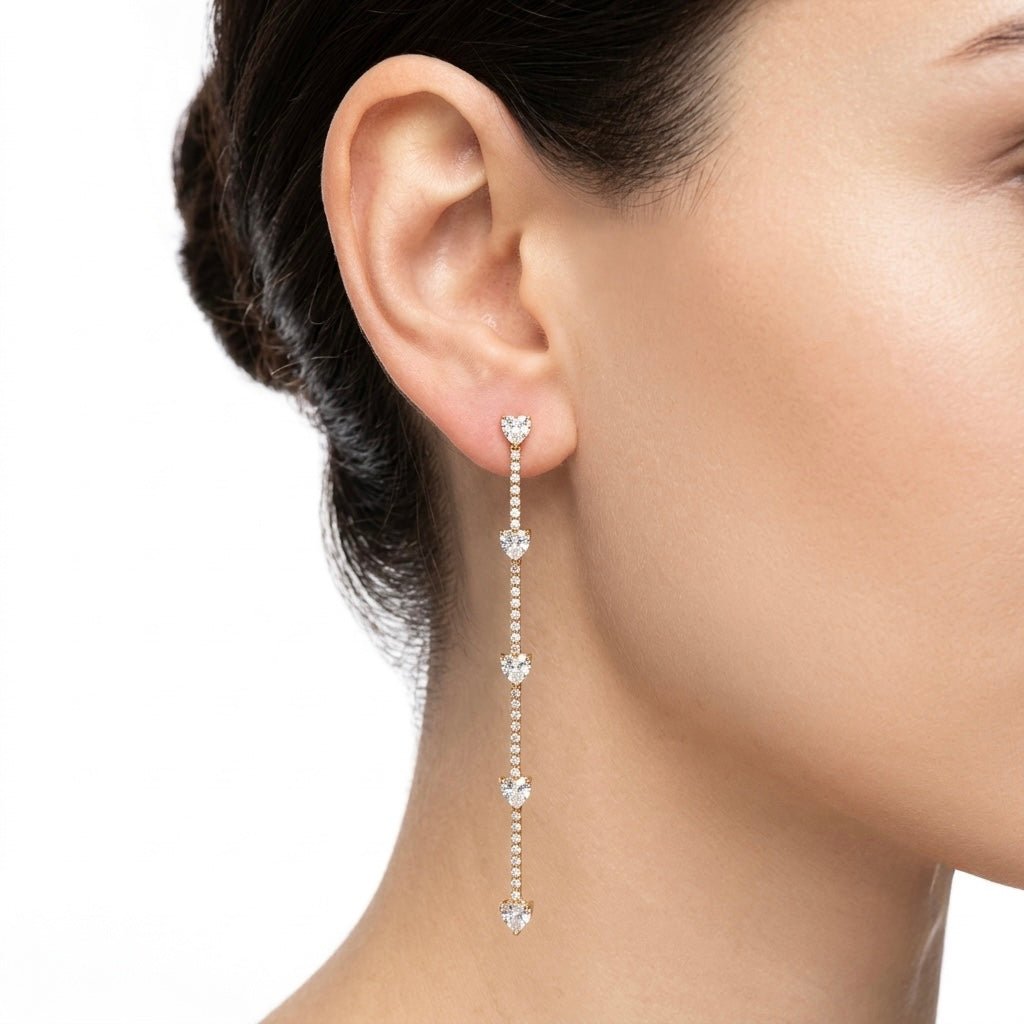 Orecchini oro pendenti con cuoricini e strass - Follie by Alice Immagine principale del prodotto