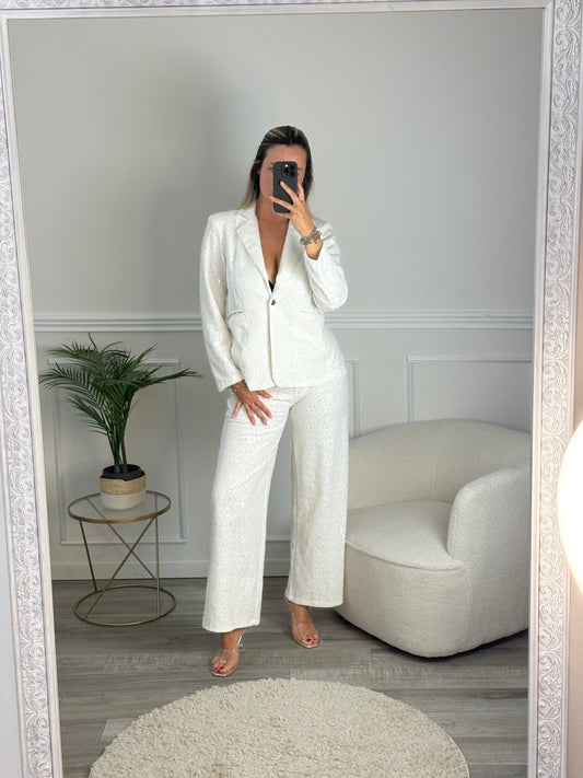 Pantaloni a palazzo con ricami floreali e paillettes