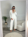 Pantaloni a palazzo con ricami floreali e paillettes