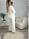Pantaloni a palazzo con ricami floreali e paillettes