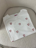 T-shirt bianca con cuoricini ricamati