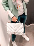 Borsa bianca morbida con borchie oro a piramide - Follie by Alice