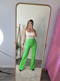 Pantaloni a palazzo verde chiaro con bottoni gioiello - Follie by Alice
