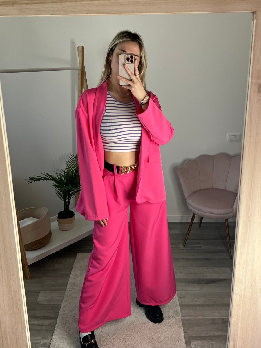 Pantaloni fucsia con fondo largo e maxi-catena